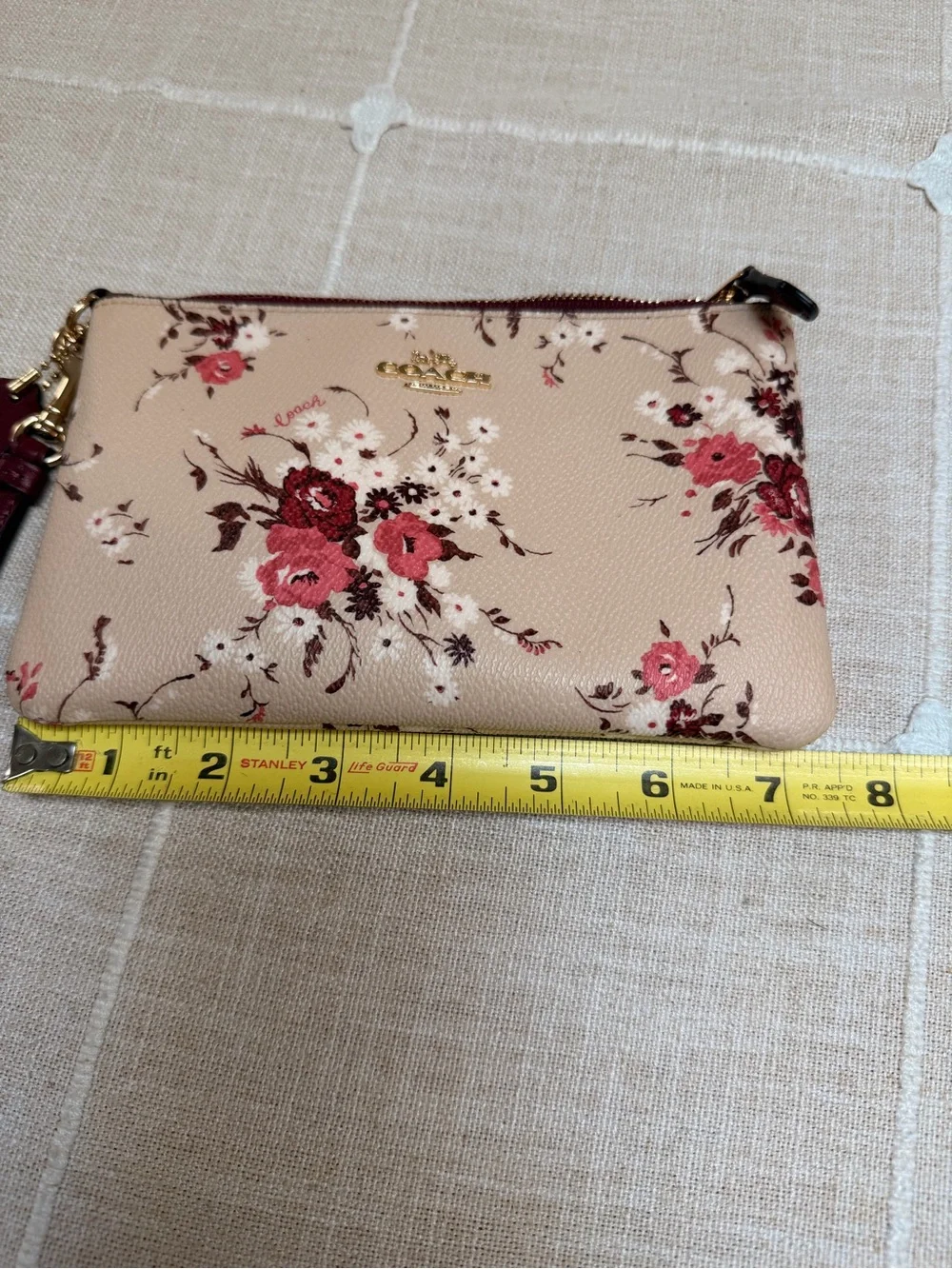 Coach Beige Floral Wristlet with Burgundy Trim